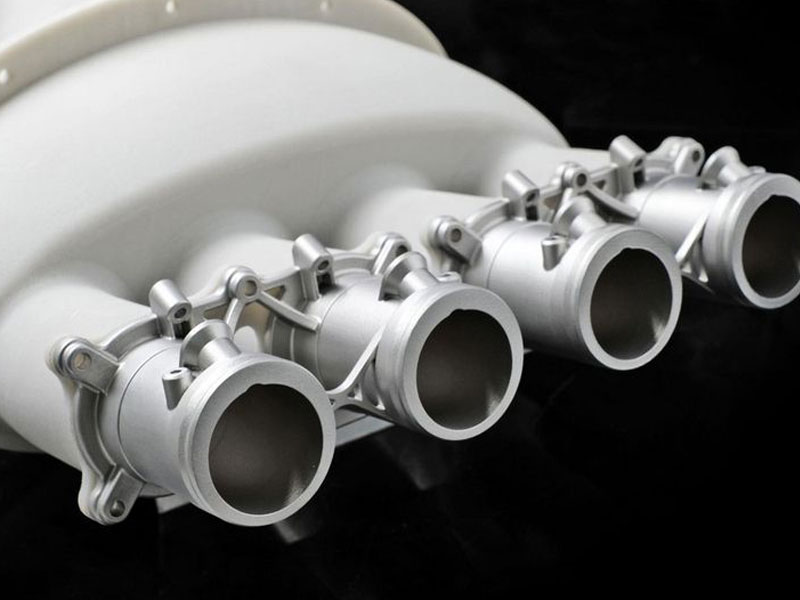 Unidad de inyección de combustible. Material: AlSi10Mg. Impresora: FS271M.